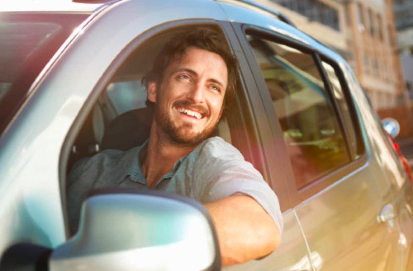 Happy driver in car